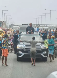 teenager-stand-in-front-of-peter-obi-convoy