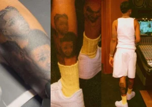 wizkid-tattoo-hin-pikin-face-for-hin-leg